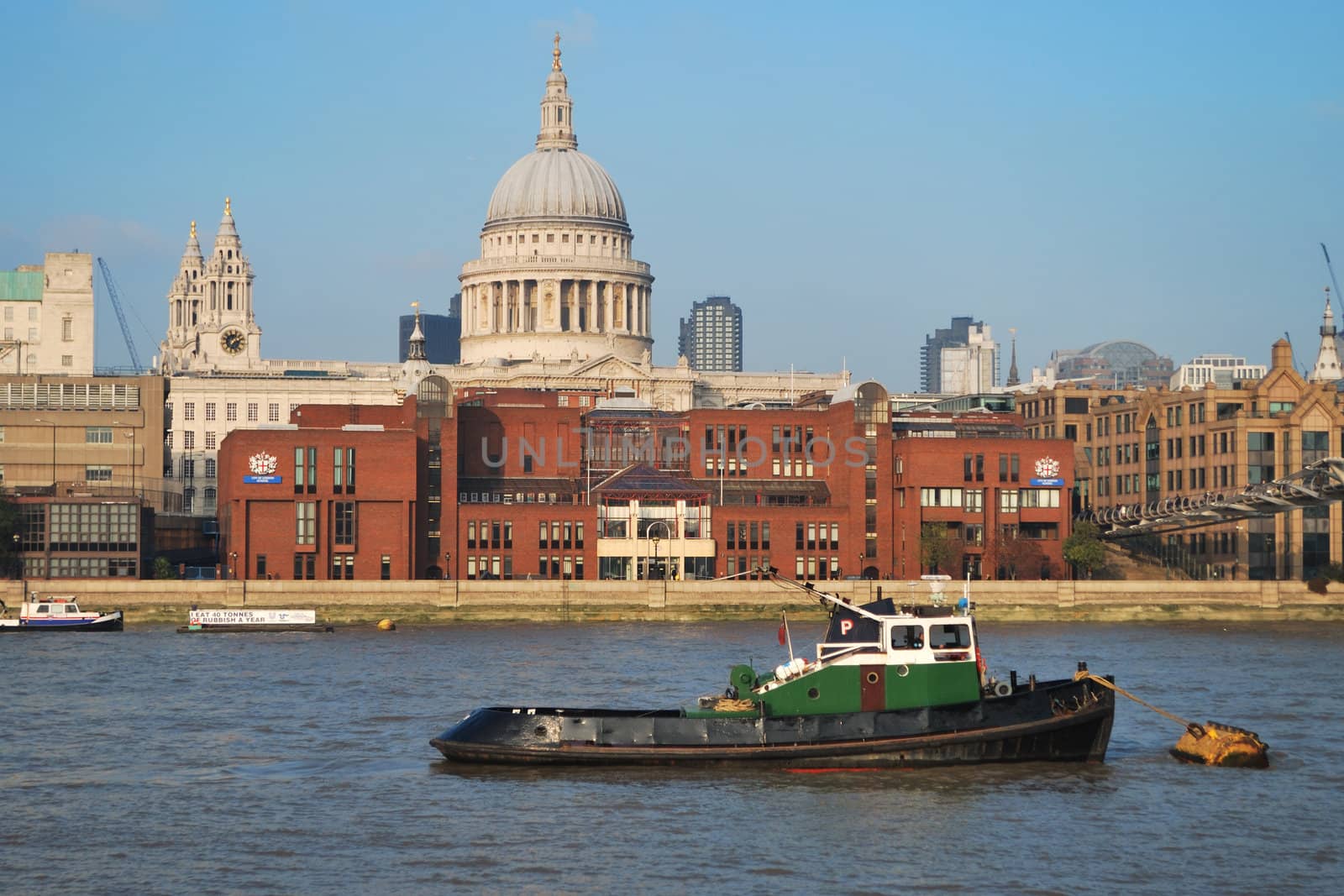 boat on thames with st pauls in background