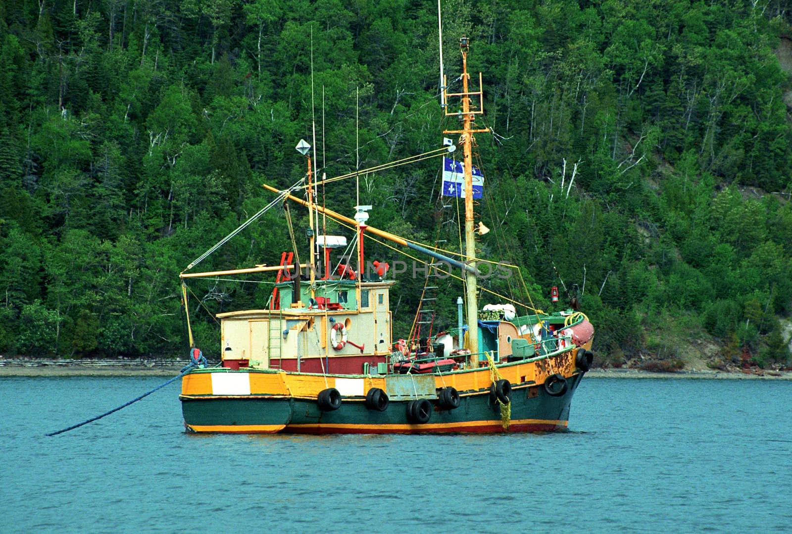 Old fishing boat anchored near Tadousac - Canada