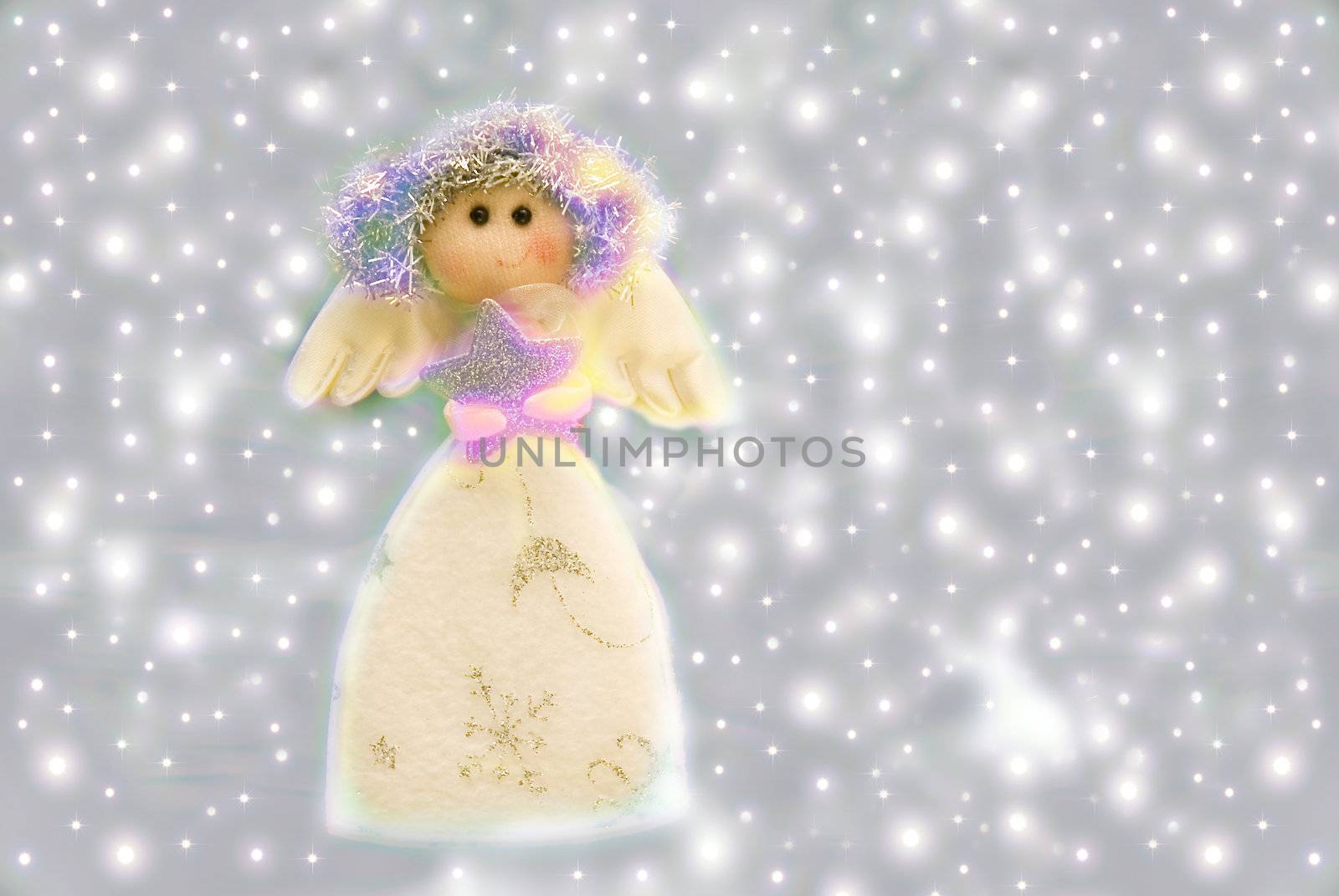 Angel Christmas decorations on a background of stars