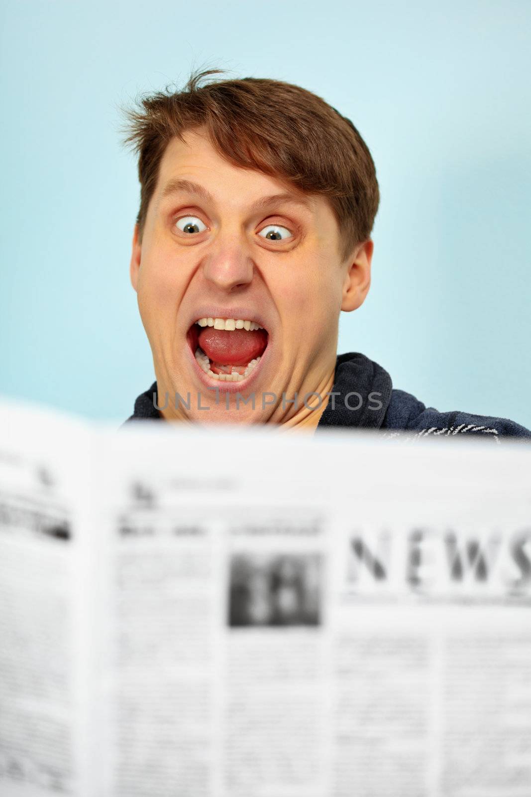 Man shocked by bad news from the newspaper
