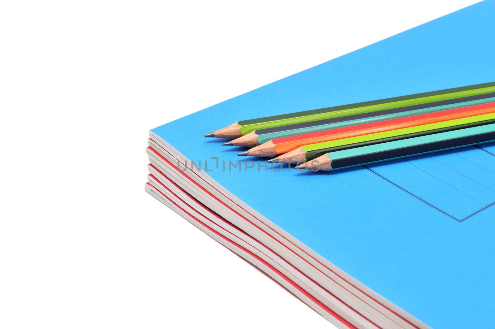 Notebook and pencils isolated on a white background