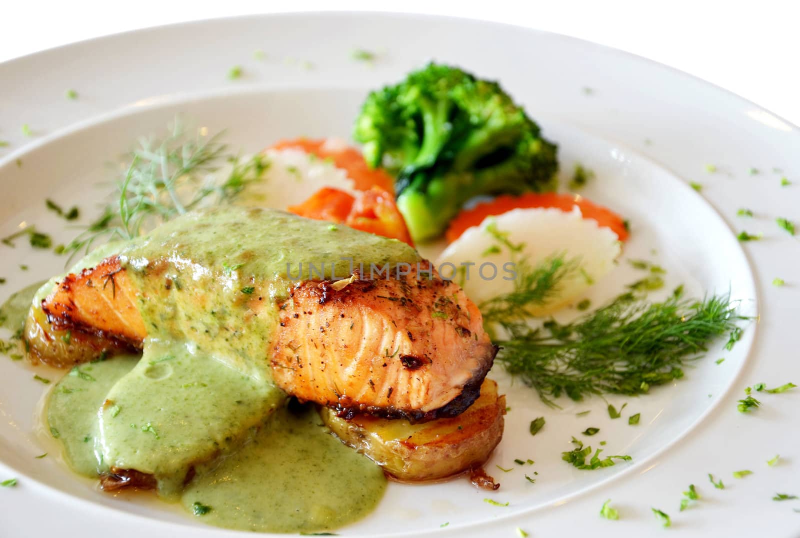 roasted salmon served with green sauce 