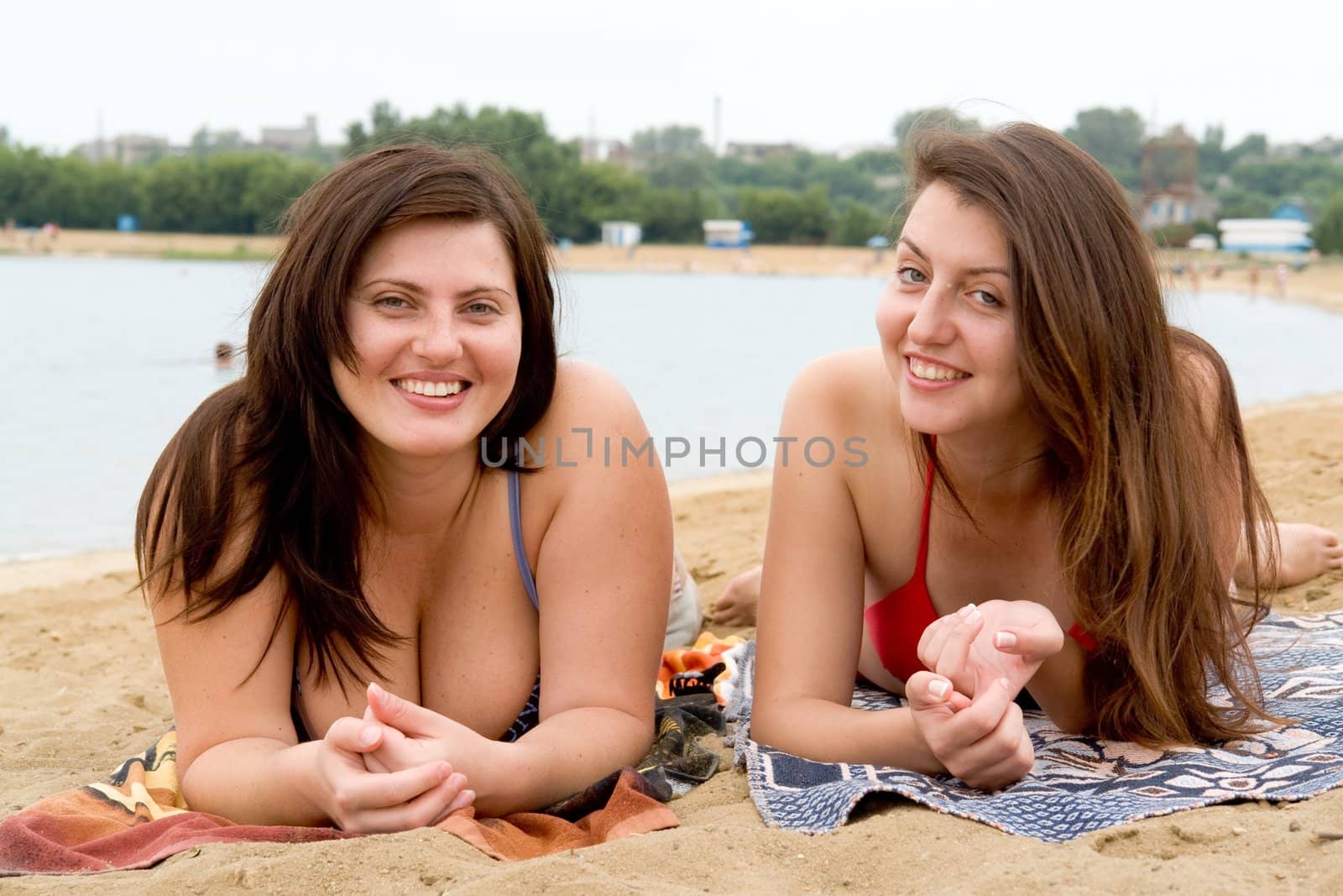 Two young pretty women on a beach