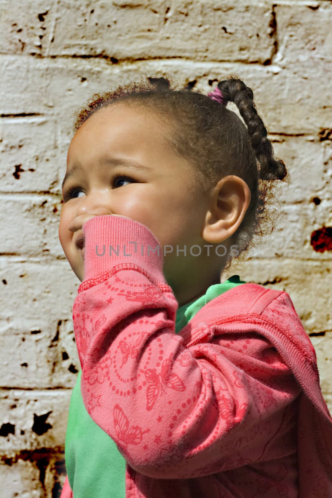 Young black baby girl playing in an alley by illu