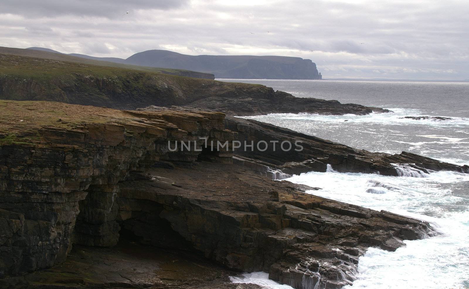 coastal cliffs on a dark cloudy day 