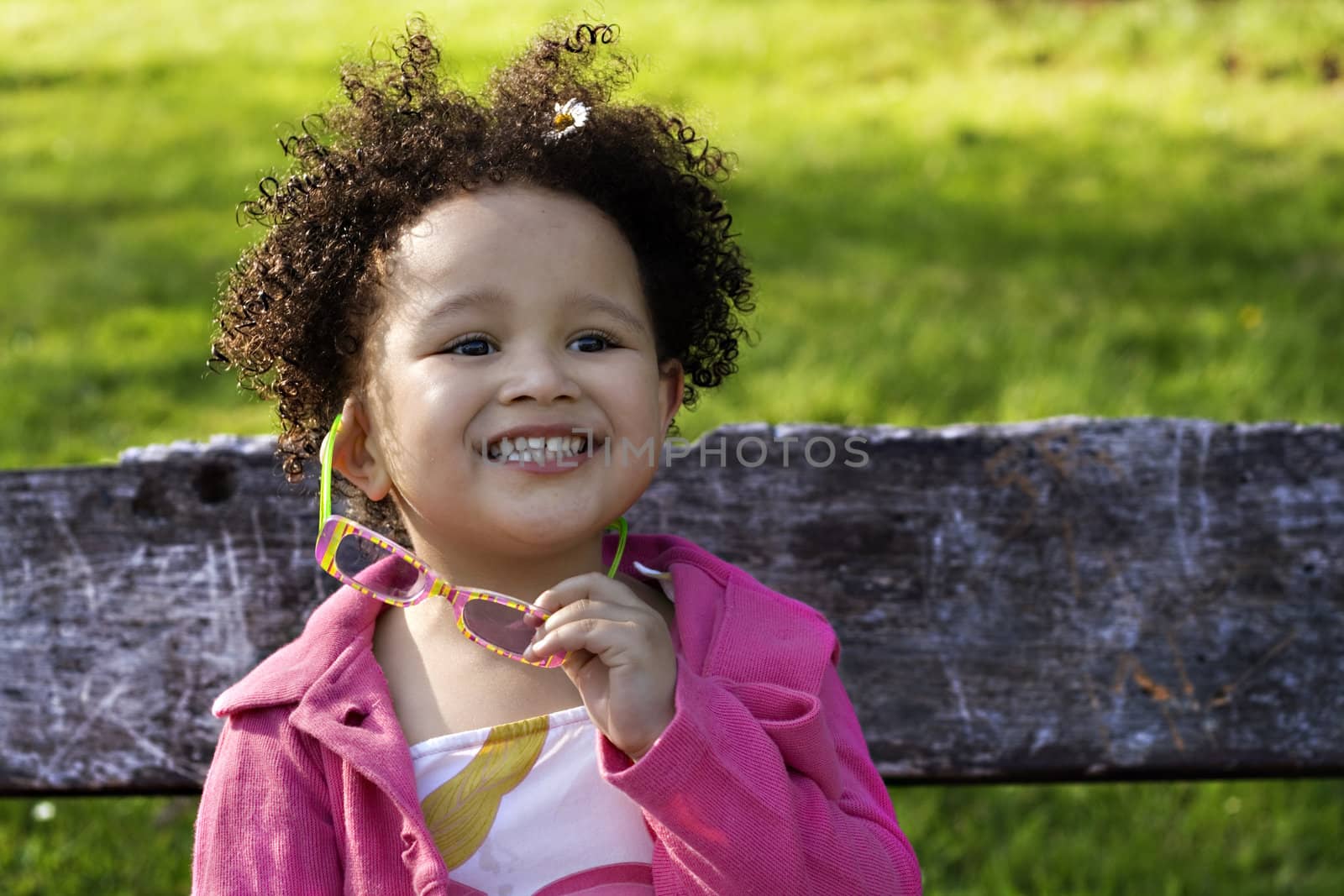 Young black baby girl with glasses smiling by illu
