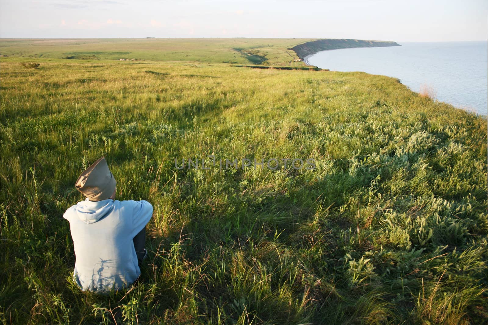 man alone in the middle of a field