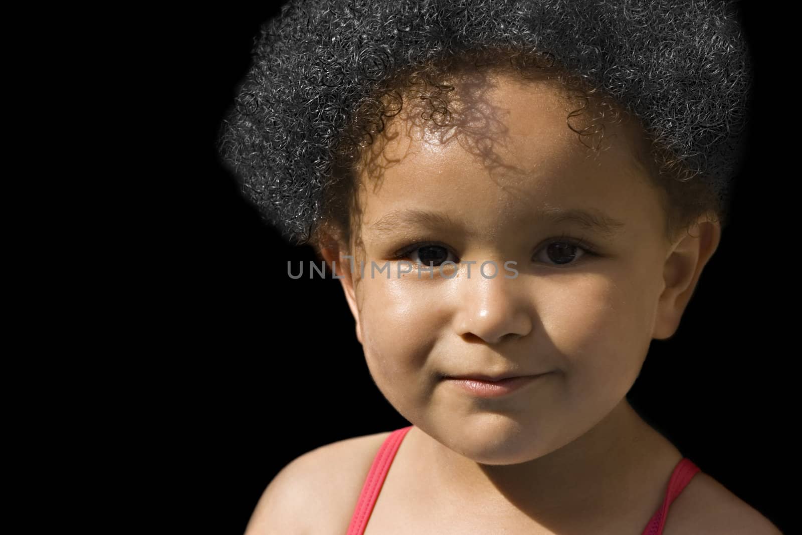 Young baby girl with curly hair