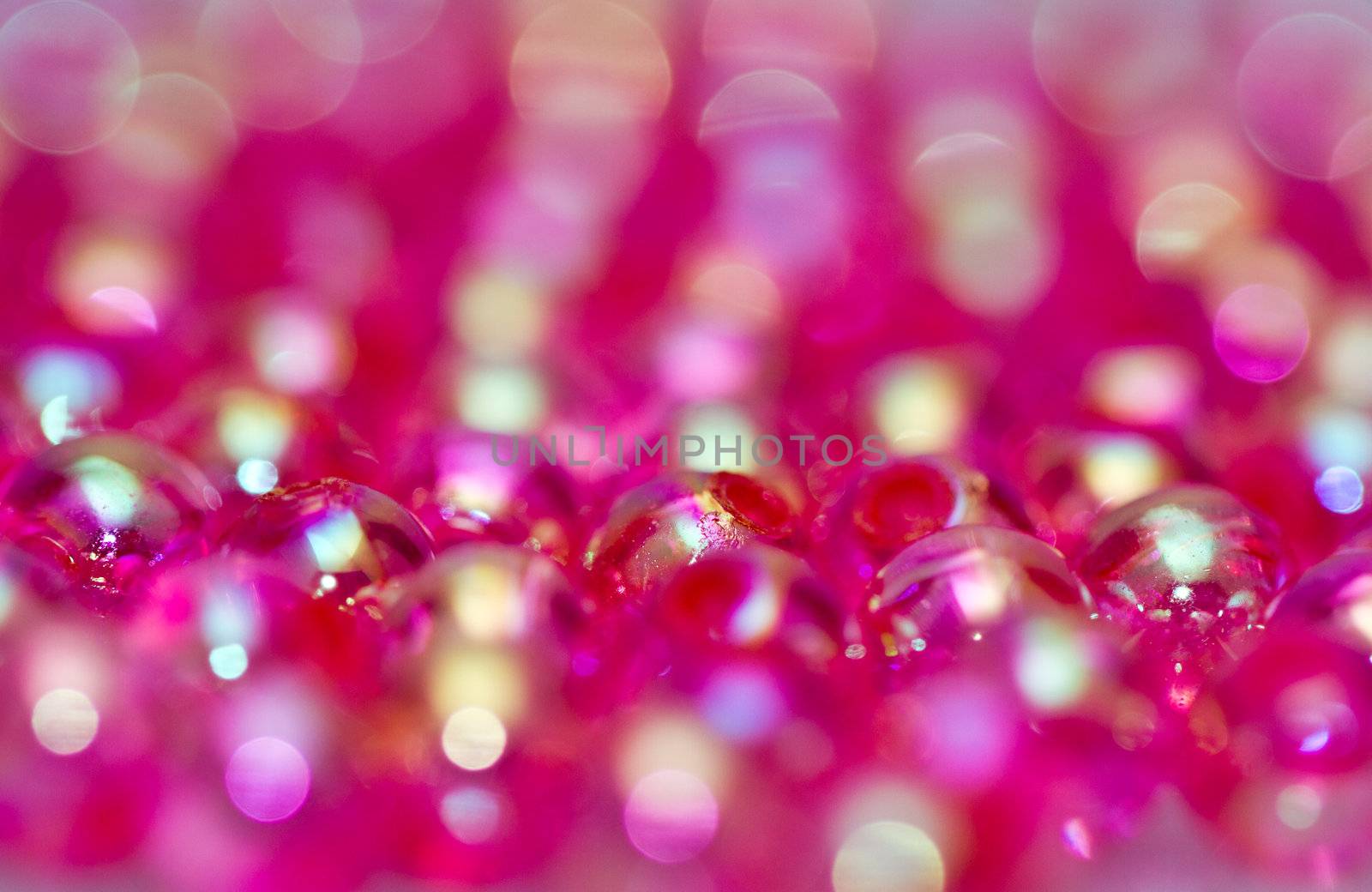 close up of red beads with shinning reflection abstract