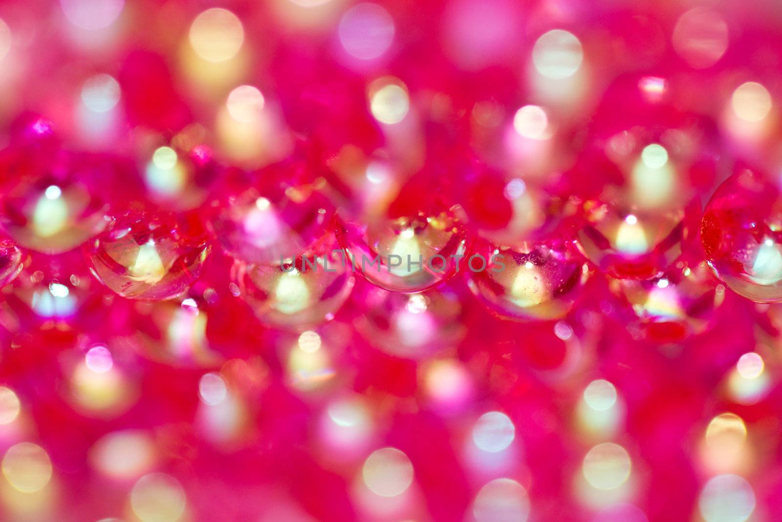 close up of red beads with shinning reflection abstract