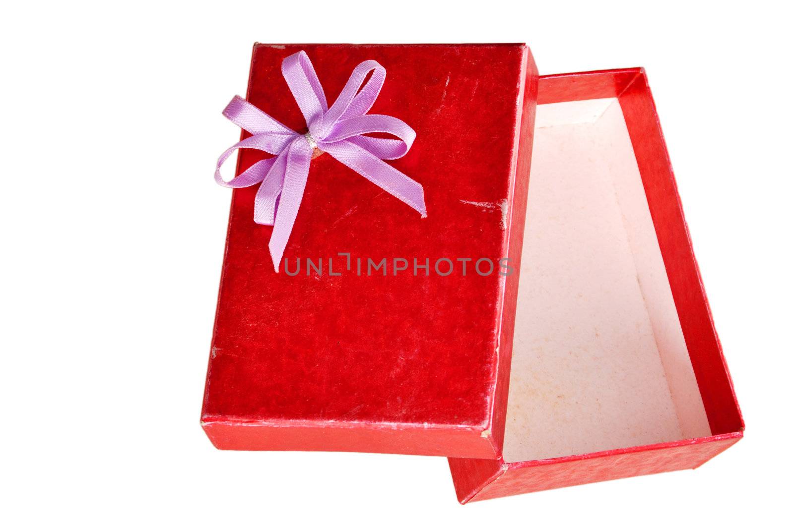 Empty old red gift box with lid and bow on a white background