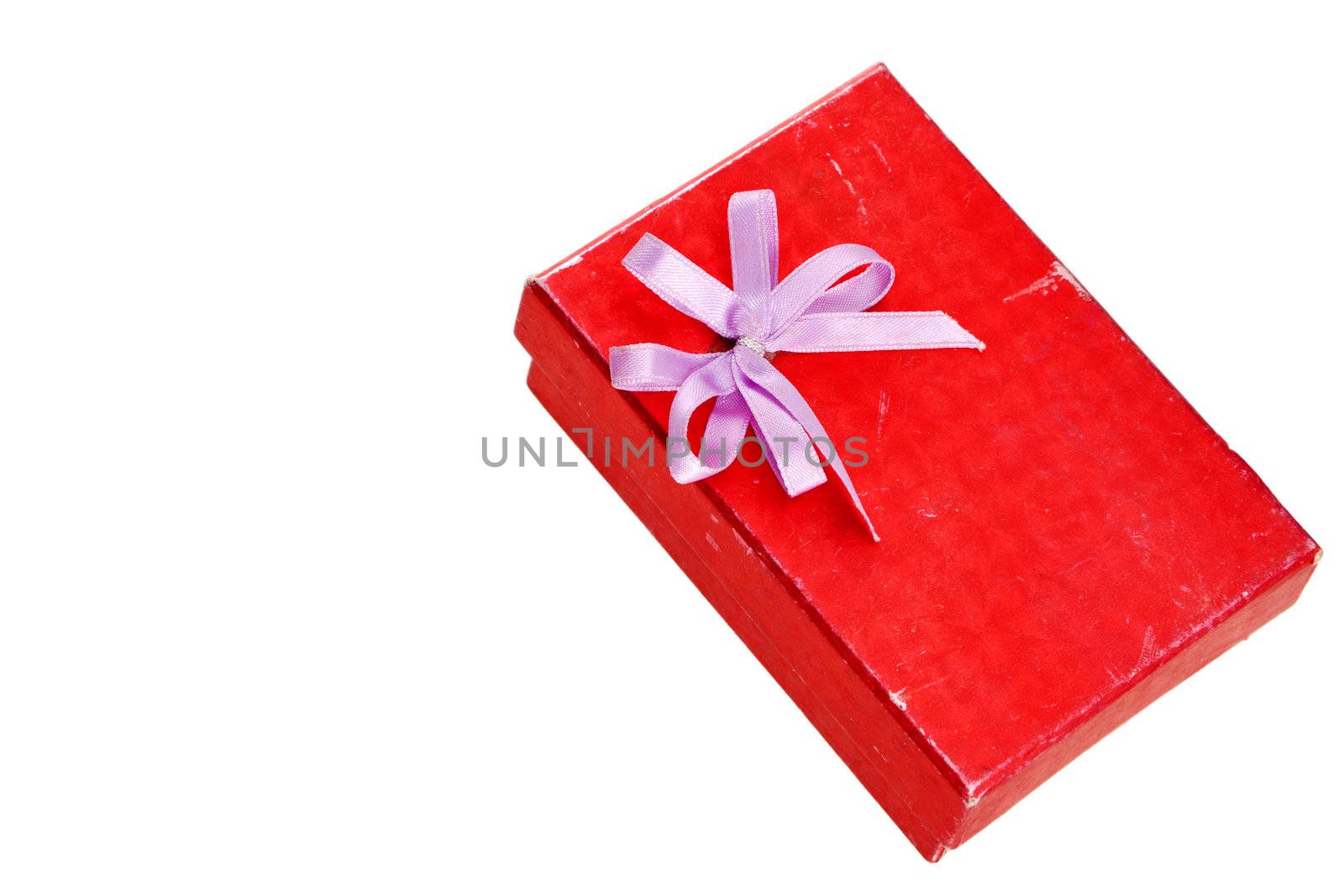 red gift box with lid and bow on a white background