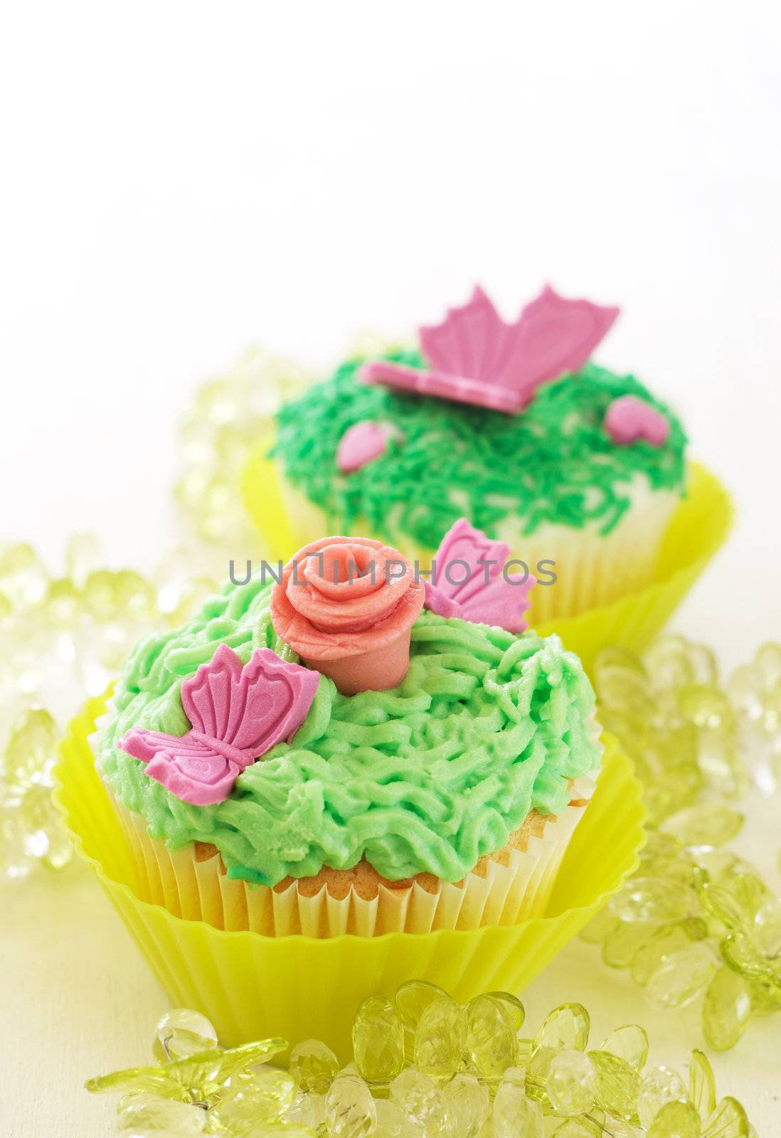 Vanilla cupcakes with various decorations by Elenat