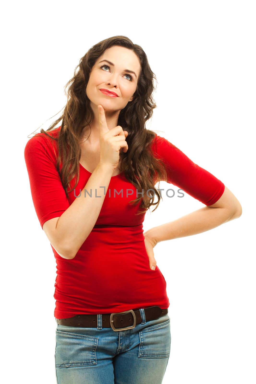 A beautiful young woman wearing a christmas red top and looking contemplative. Isolated over white.
