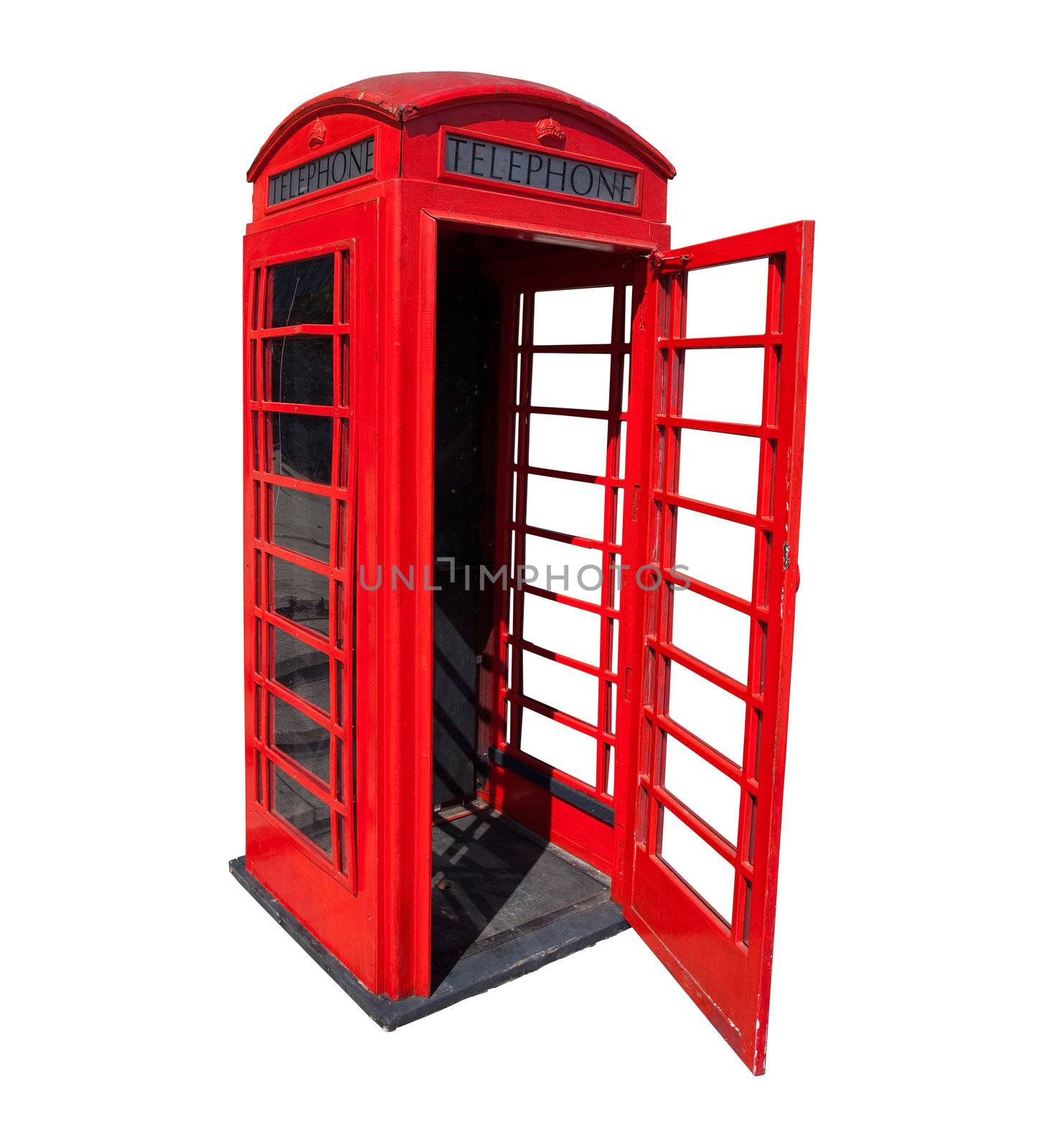 Old red phone booth with open door in London isolated with clipping path