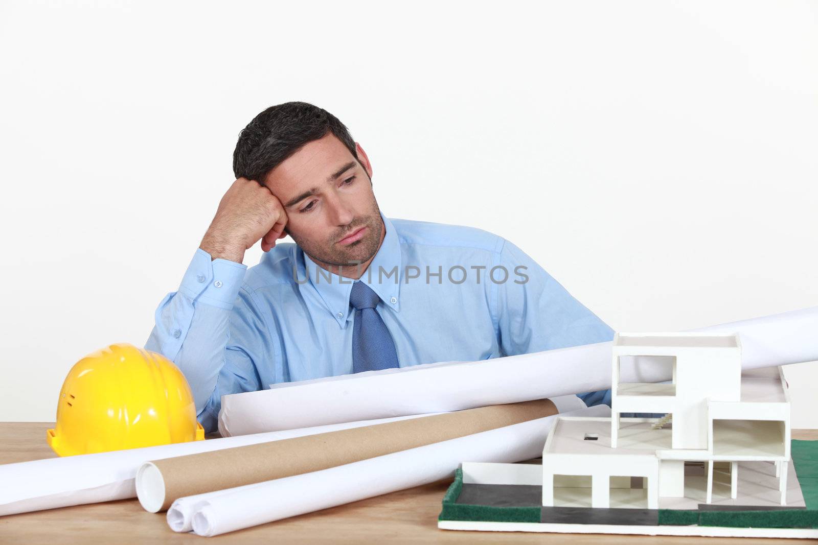 A bored architect at his desk.