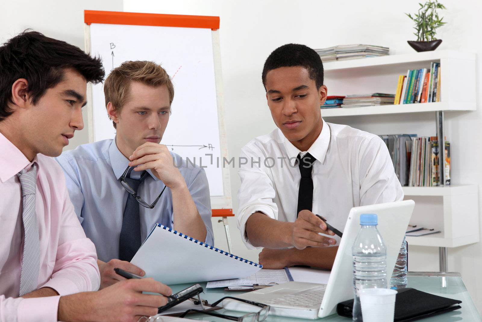 Young business professional discussing the results of a report