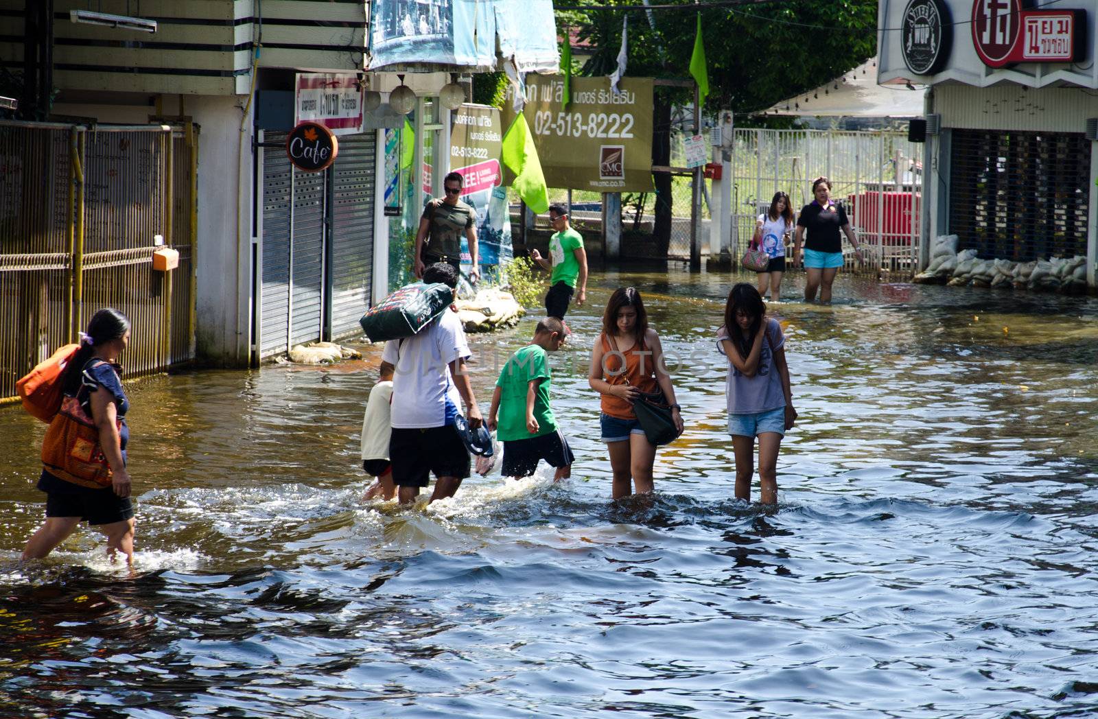 BANGKOK THAILAND – NOVEMBER 13 : the victims of flood waiting for higher vehicle in Phahon Yothin Road November 13, 2011 in Bangkok, Thailand.