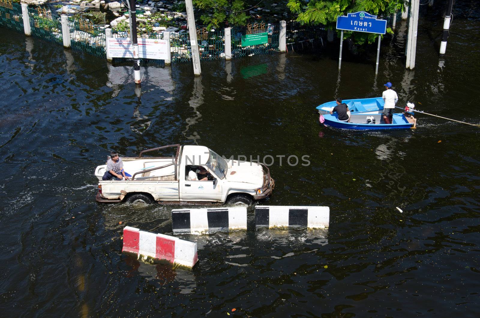 Transportation of people in the streets flooded by chatchai