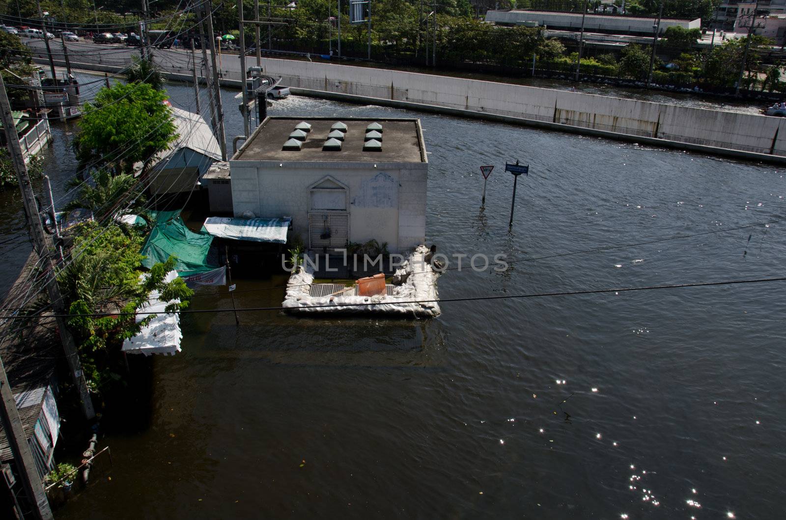 BANGKOK THAILAND – NOVEMBER 13: Scenes The Siam Commercial Bank, Limited in Bangkok during its worst flooding in decades is a major disaster on November 13, 2011 in Bangkok, Thailand.