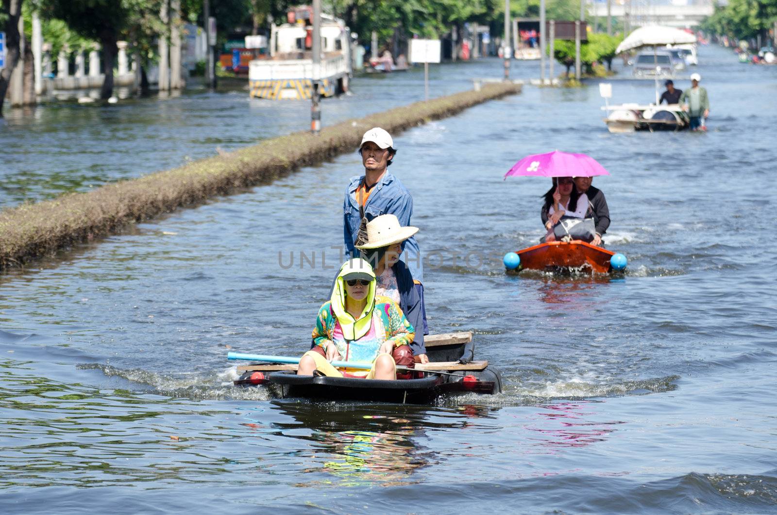 BANGKOK, THAILAND-NOVEMBER 13: Transportation of people in the streets flooded after the heaviest monsoon rain in 50 years in the capital on November 13, 2011 Phahon Yothin Road, bangkok, Thailand.