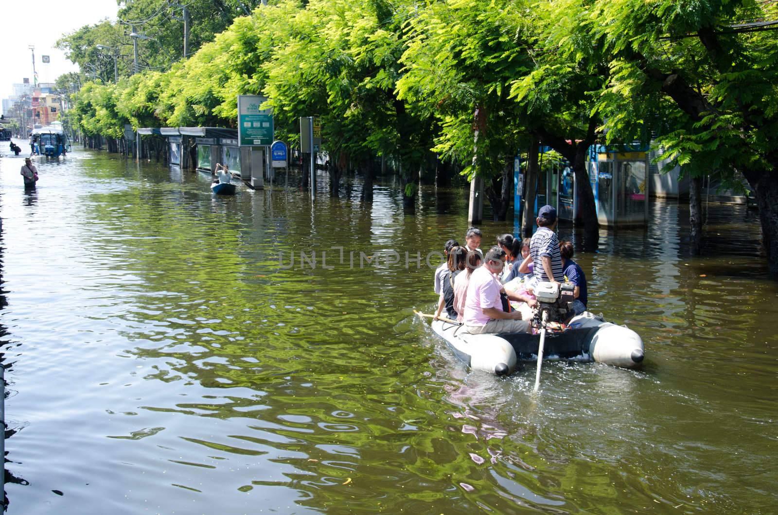 Transportation of people in the streets after flood by chatchai