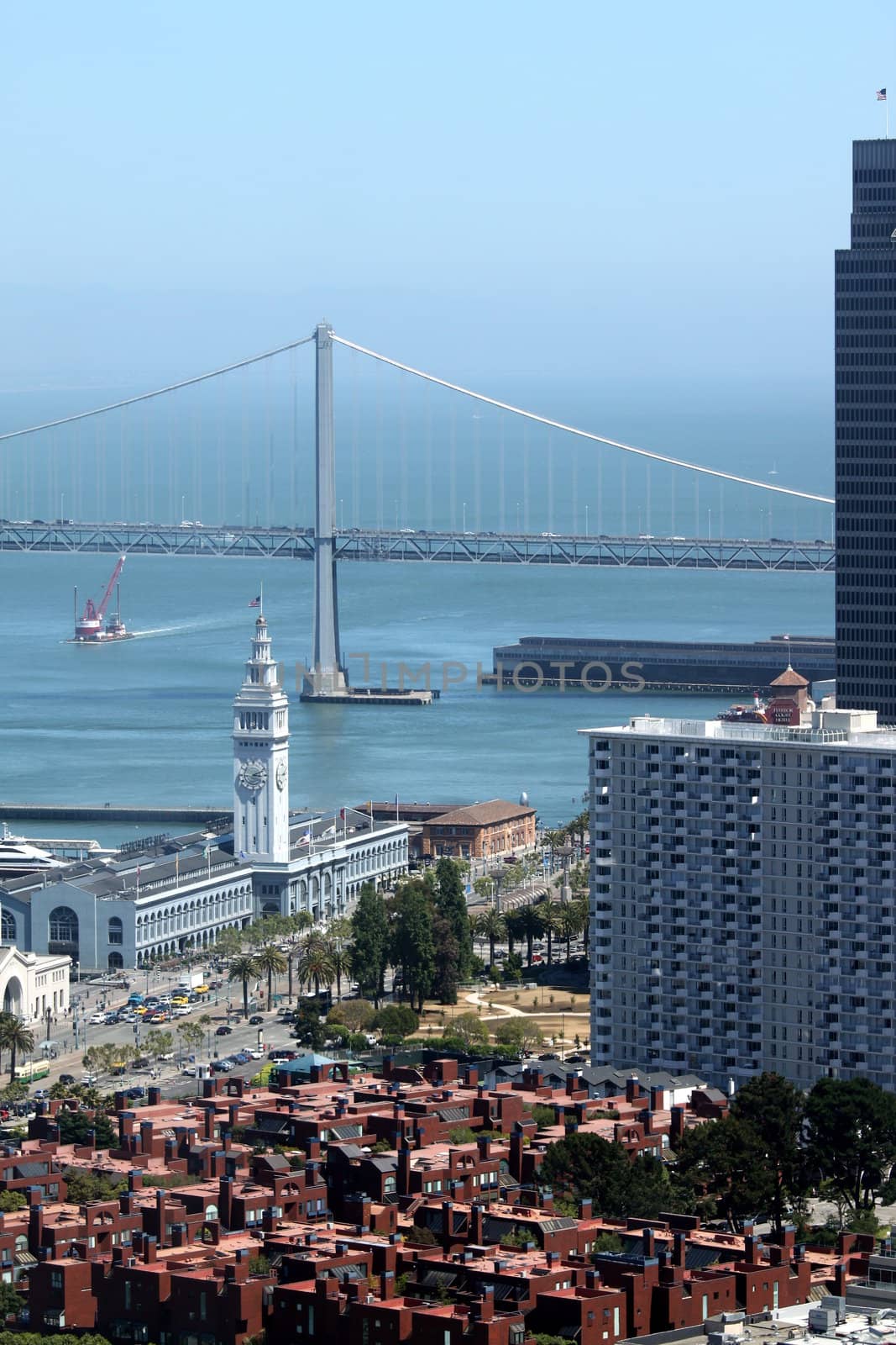 The Bay Bridge with houses from San Francisco in the foreground