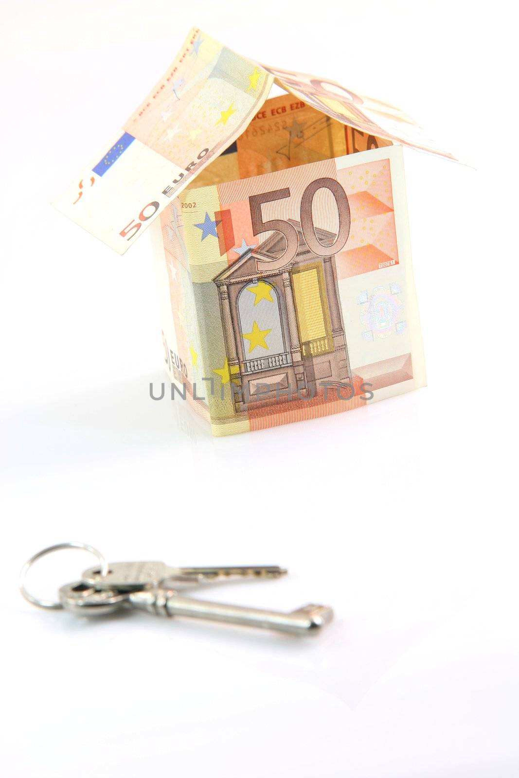 finance banking constuction and business concepts house with euro money and keys blur in front isolated on white background