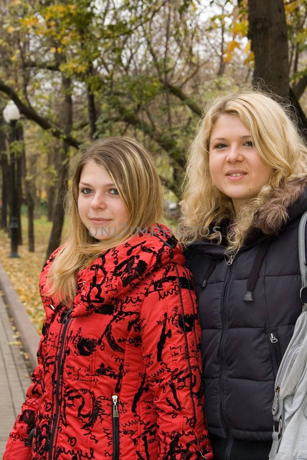 Two young women in a autumn park