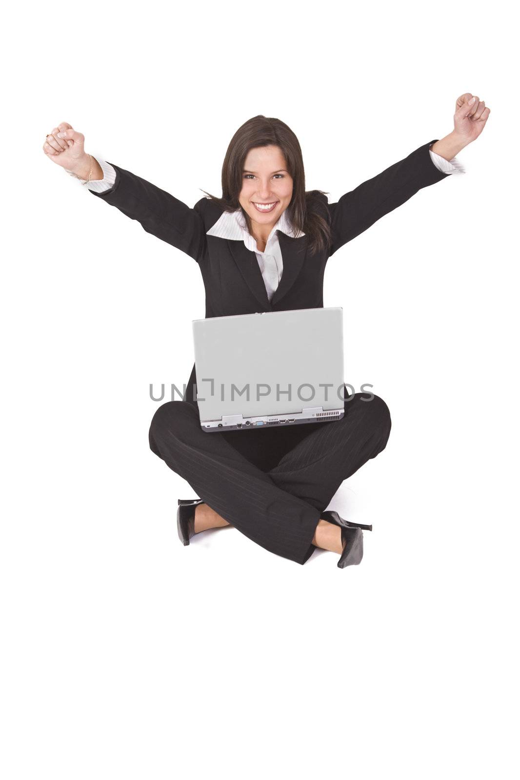 Businesswoman expressing satisfaction with a laptop in her lap.