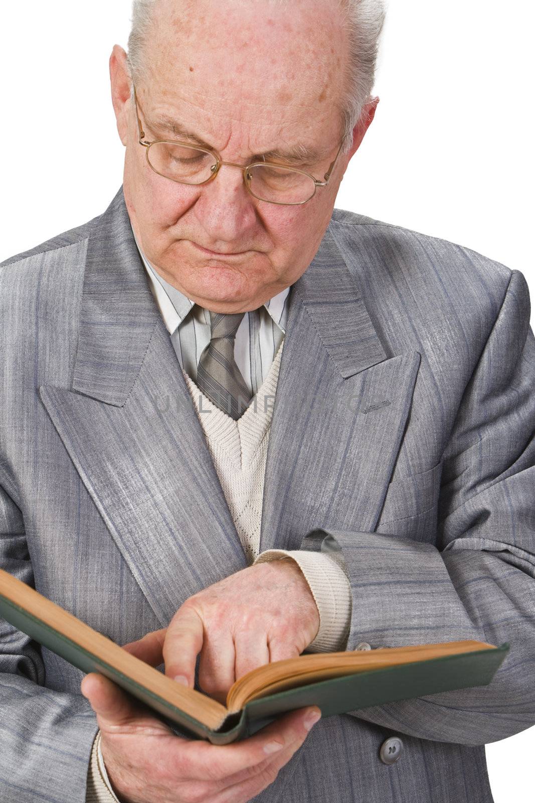 Close-up image of a senior man reading a book attentively.Shot with Canon 70-200mm f/2.8L IS USM