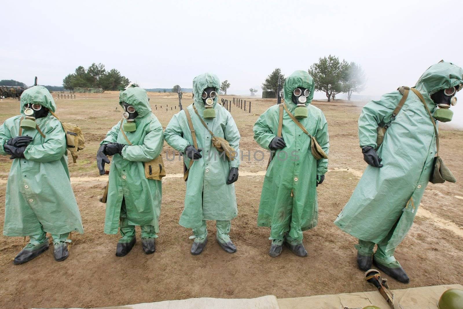  soldiers dress chemical protection suites.