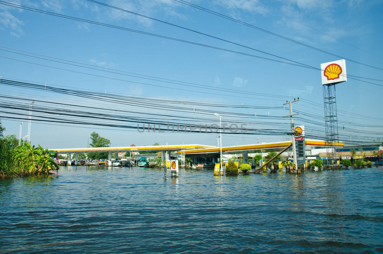 PATHUM THANI THAILAND – NOVEMBER 14: Gas station in Pathum Thani  during its worst flooding in decades is a major disaster on November 14, 2011  in Pathum Thani, Thailand.
