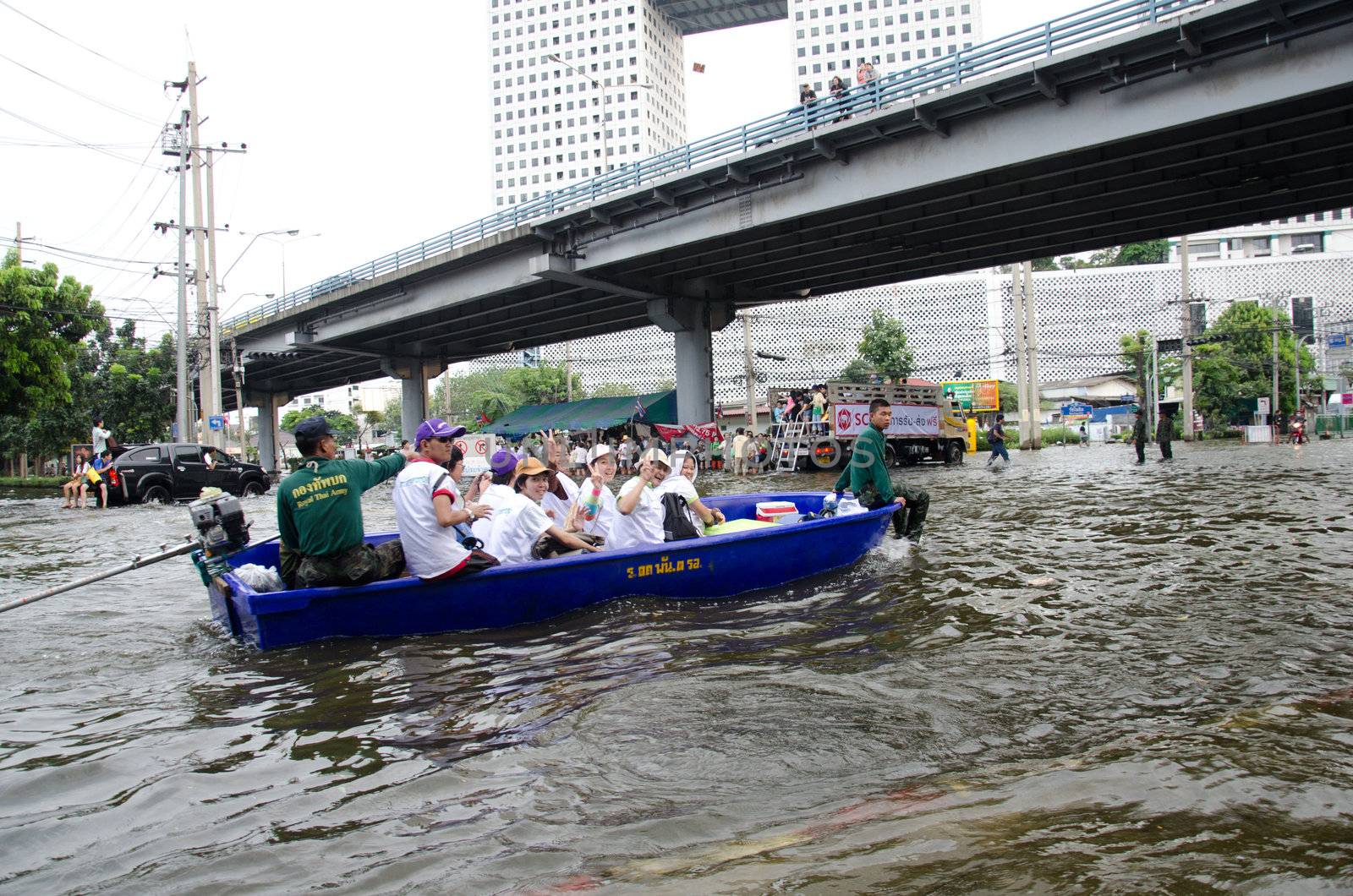 Transportation of people in the streets after flood by chatchai