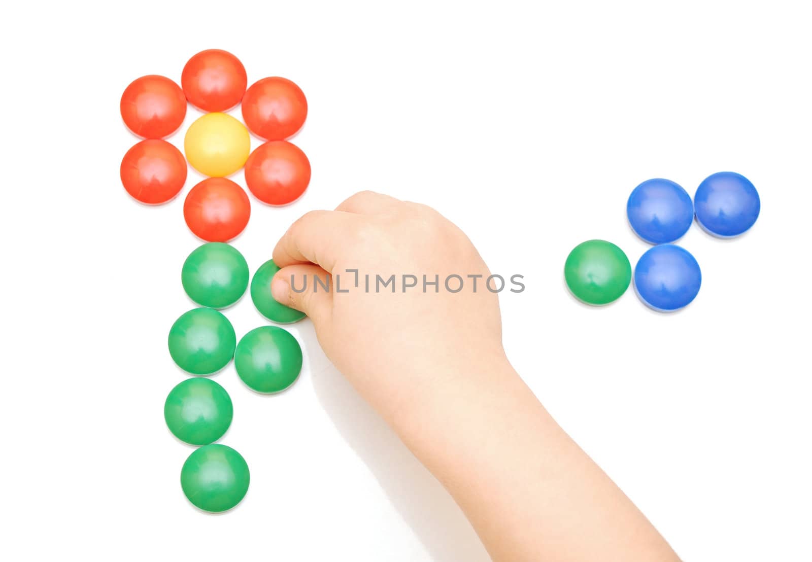 Hand and toy button on white background