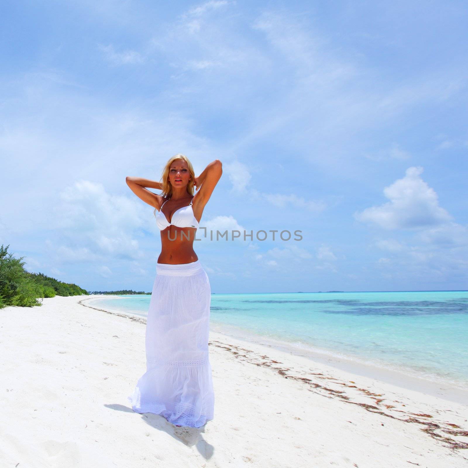 woman in bikini on beach by Yellowj