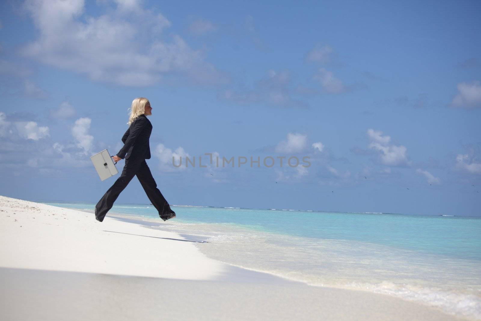 business woman jump in ocean by Yellowj