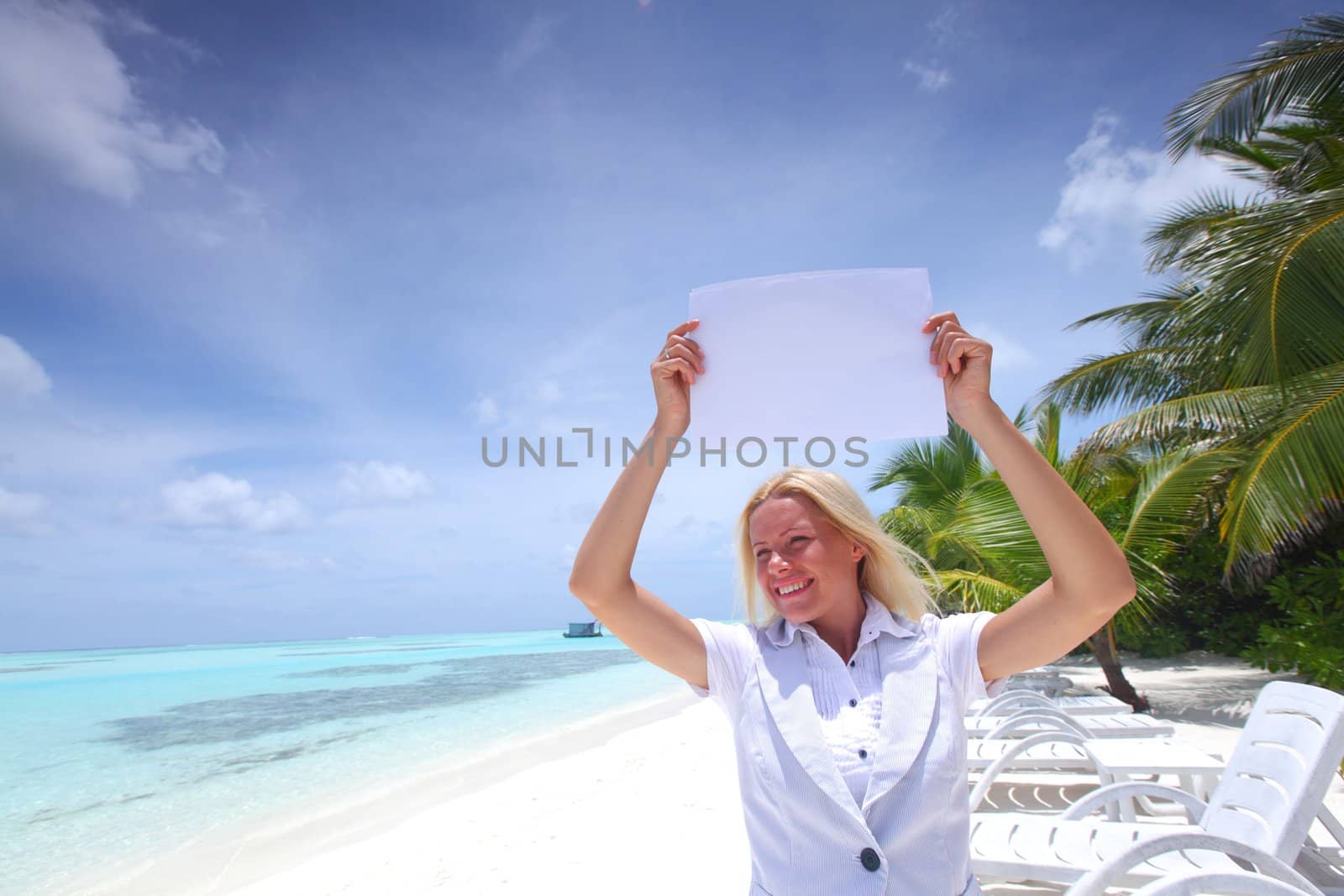 business woman with blank paper on the ocean coast by Yellowj