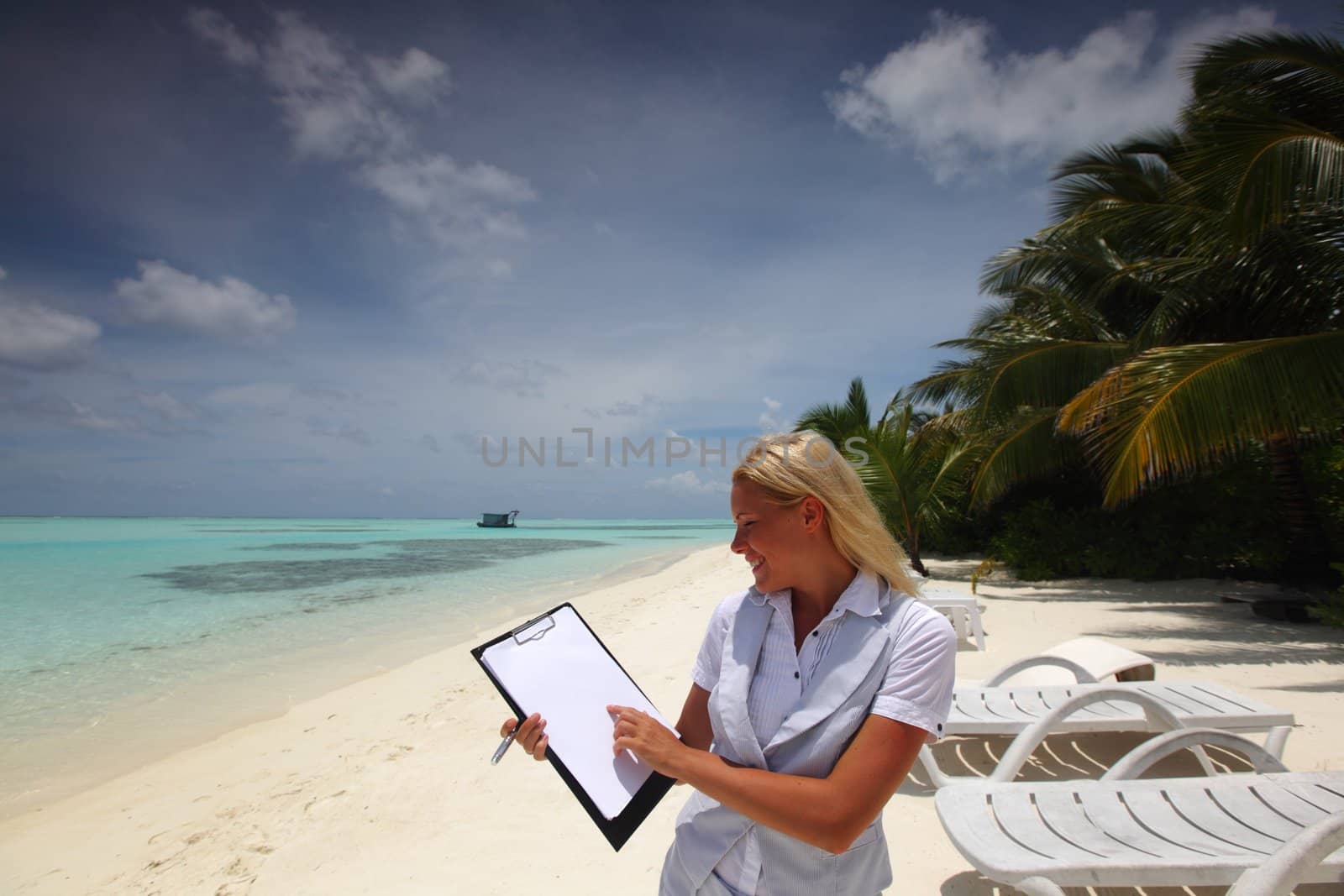 business woman with blank paper on the ocean coast by Yellowj