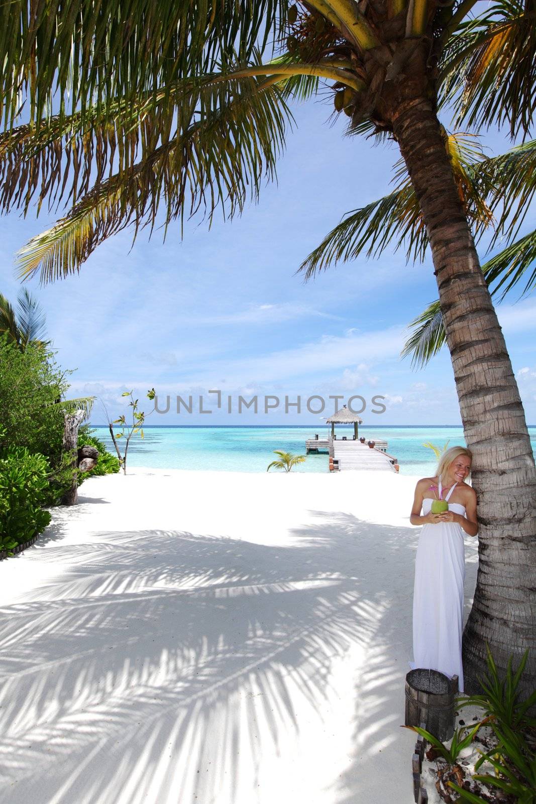 woman in a white dress on the ocean coast