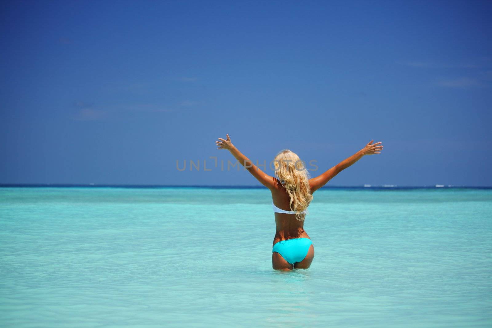 woman  playing in ocean water