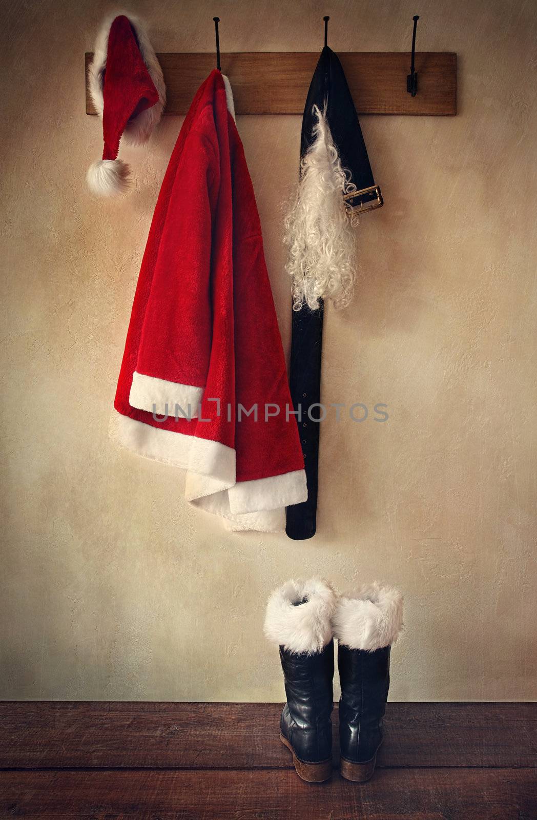 Santa costume with boots on coatrack by Sandralise