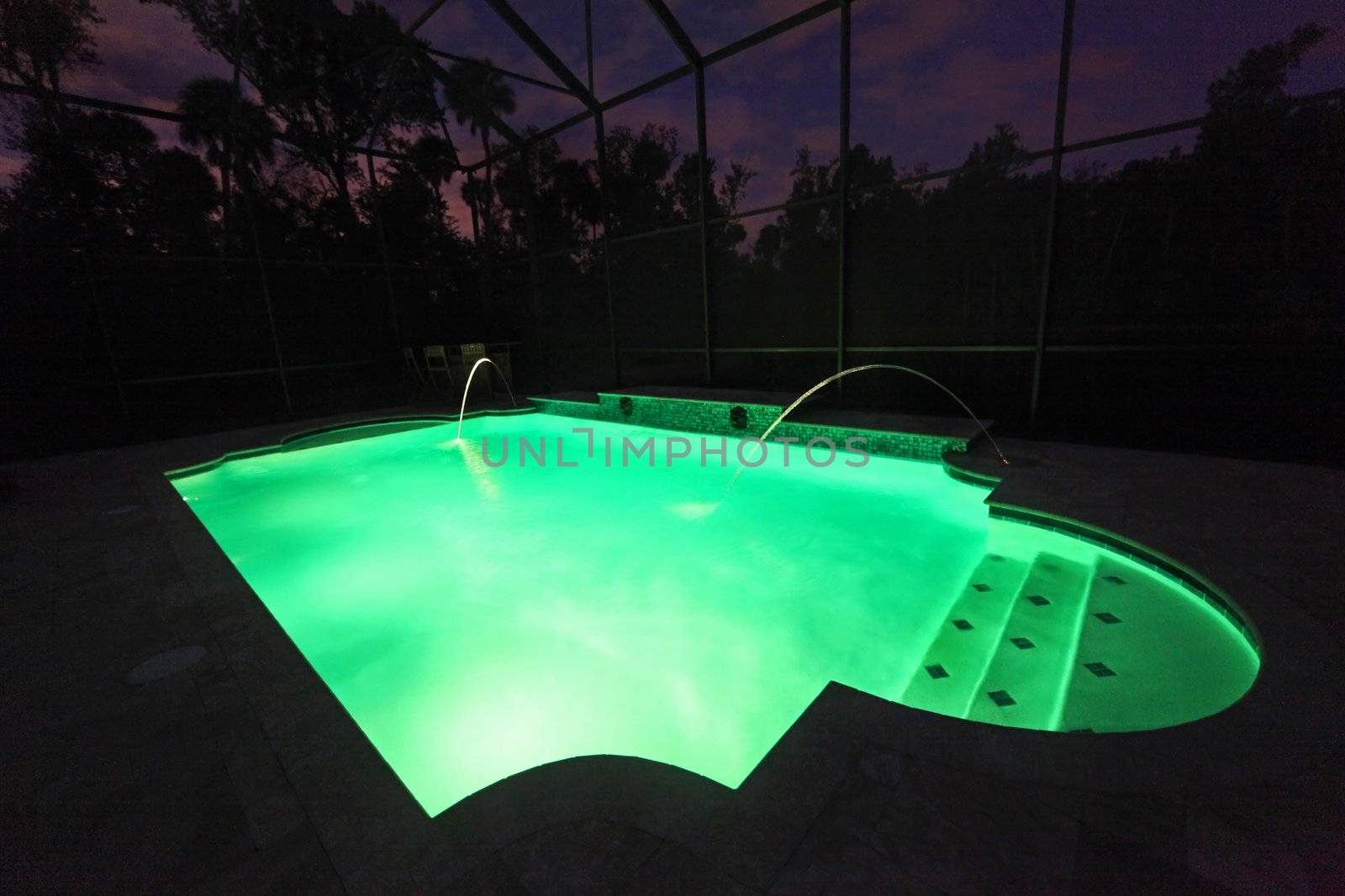 A Swimming Pool lit up at night