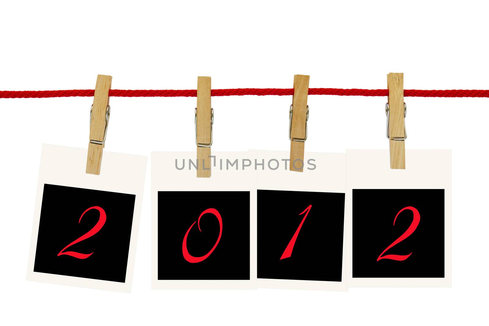 Photo frames 2012 hang by wooden peg on white background