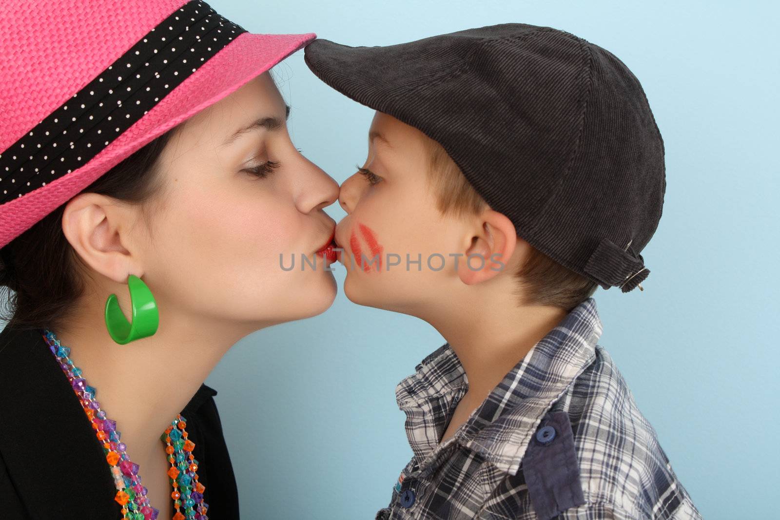 Brunette mother kissing her son on his lips