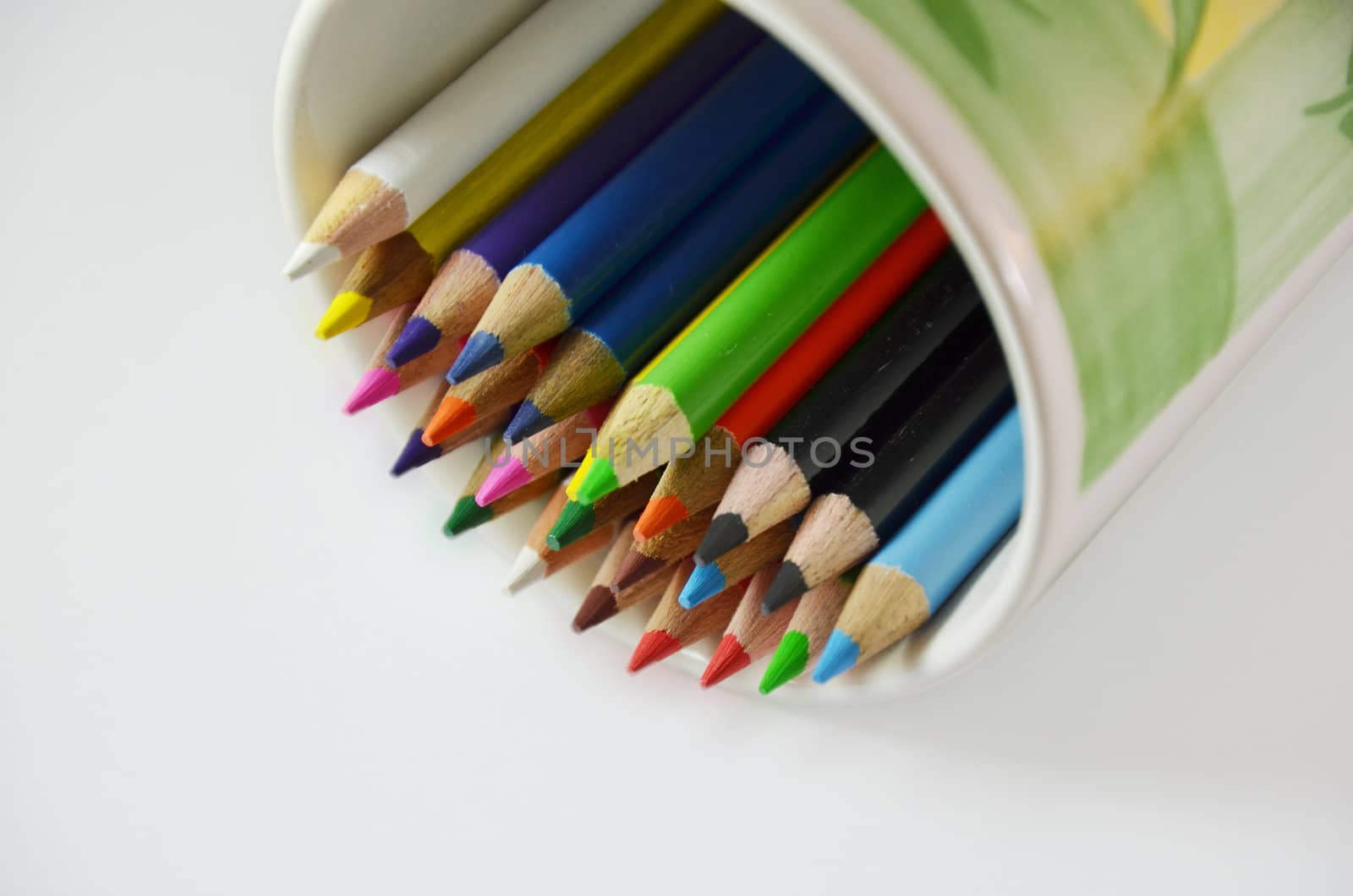 Many colorful pencils in the cup