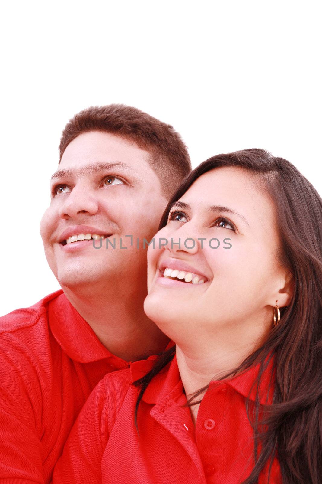 Young loving couple looking up to the sky, standing over white, by dacasdo