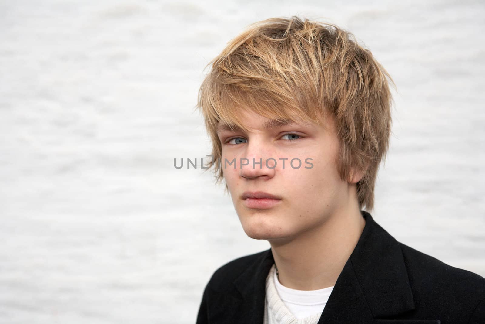 Portrait of serious teenage boy, looking at camera