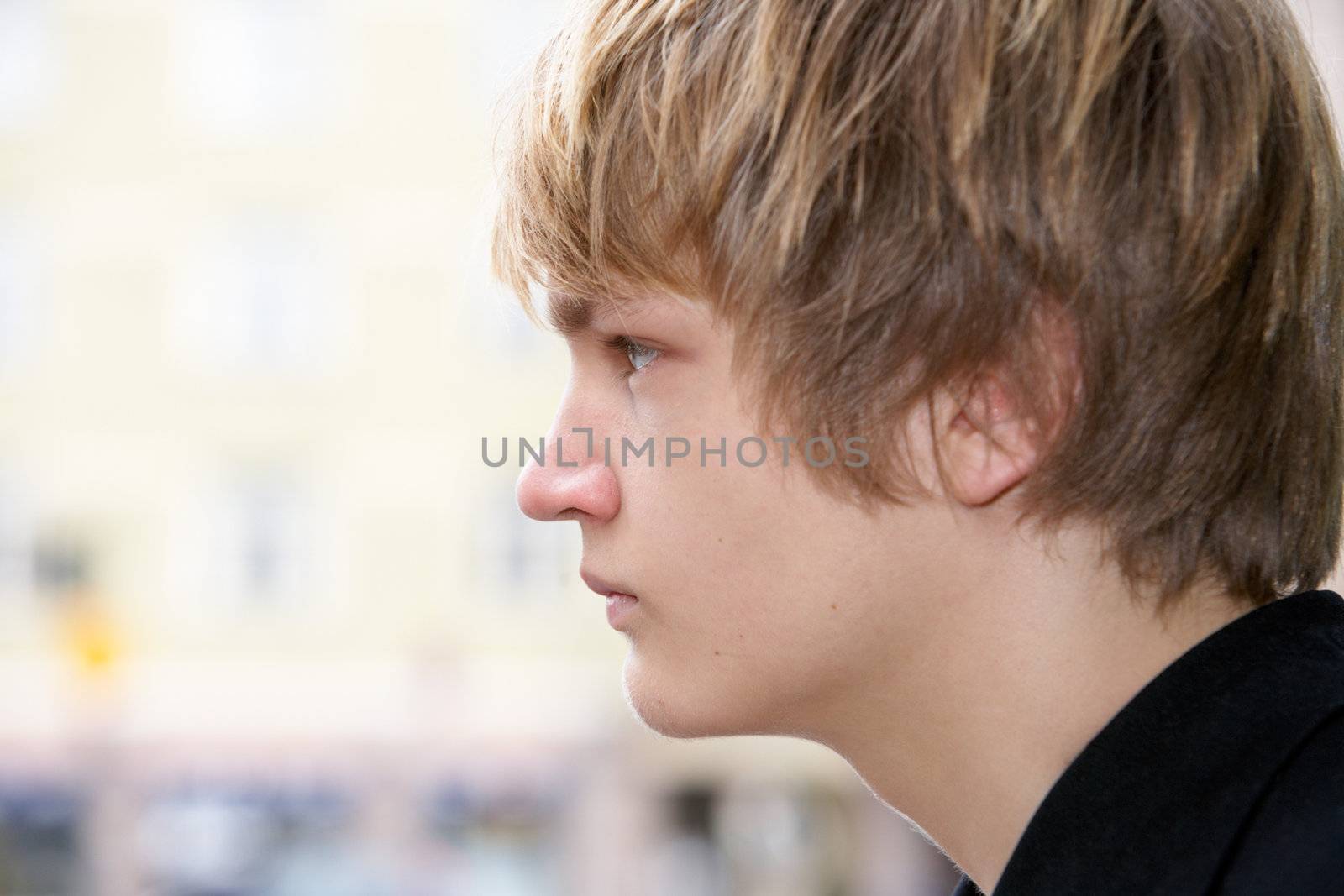 Teenage boy side profile, close-up headshot