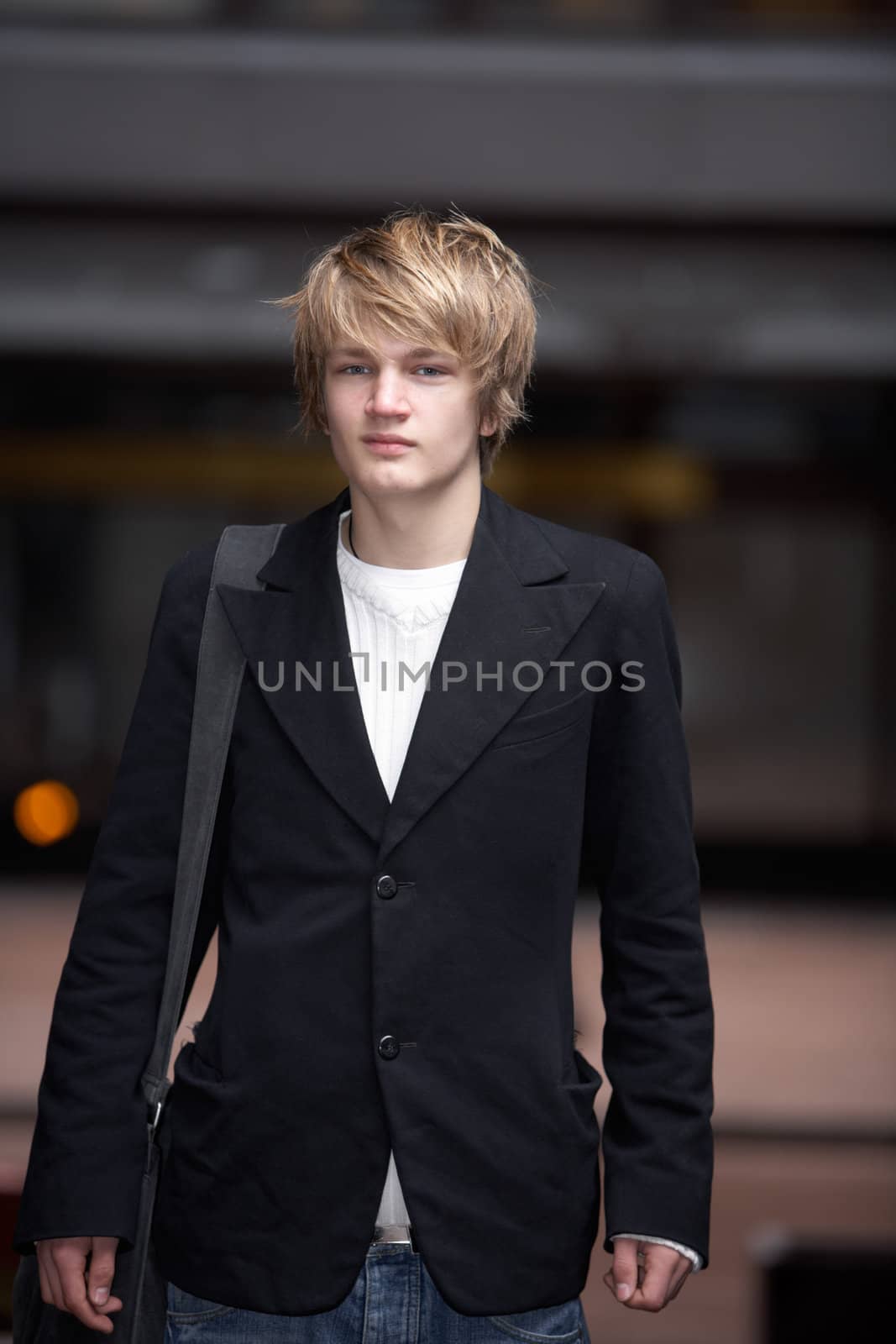 Portrait of teenage boy standing in street